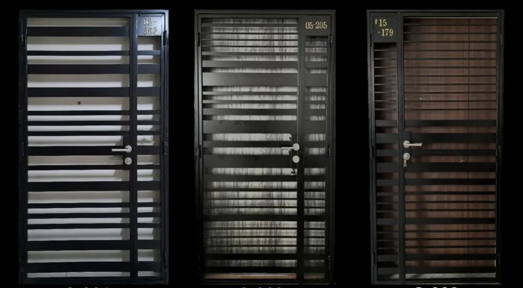 Three black metal HDB main gates in Singapore featuring horizontal grille patterns: wide horizontal bars with light panels on the left (unit 02-362), standard horizontal bars in the centre (unit 05-205), and horizontal bars with darker wood-effect panels on the right (unit 15-179).
