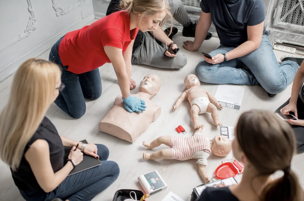 Instructor demonstrating standard first aid course skills